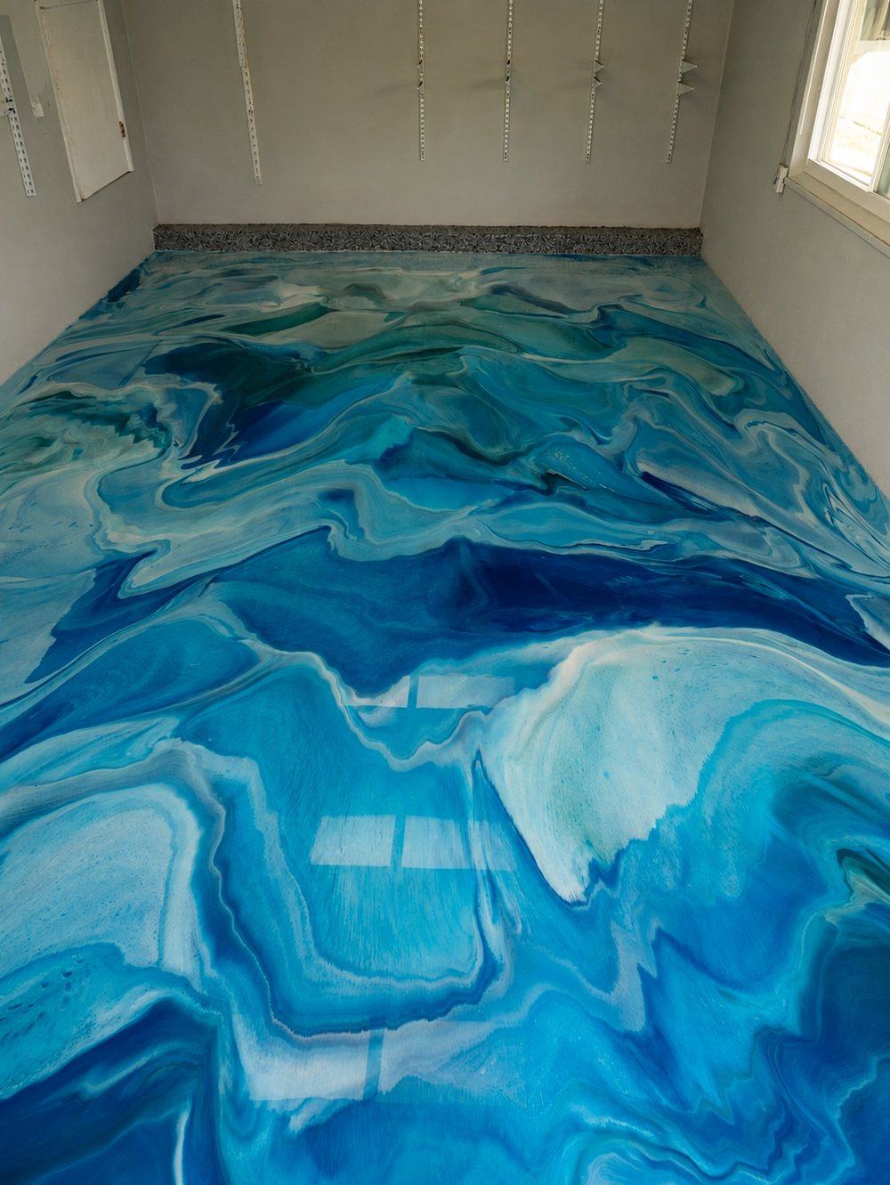 The same garage finished in blue metallic epoxy