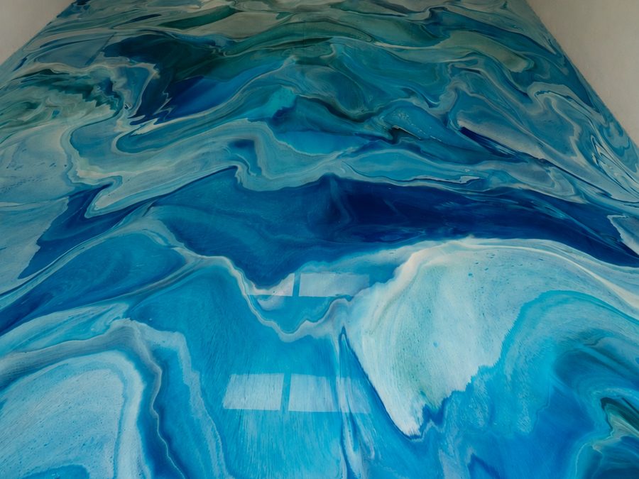 Blue metallic epoxy floor in a St. Petersburg garage